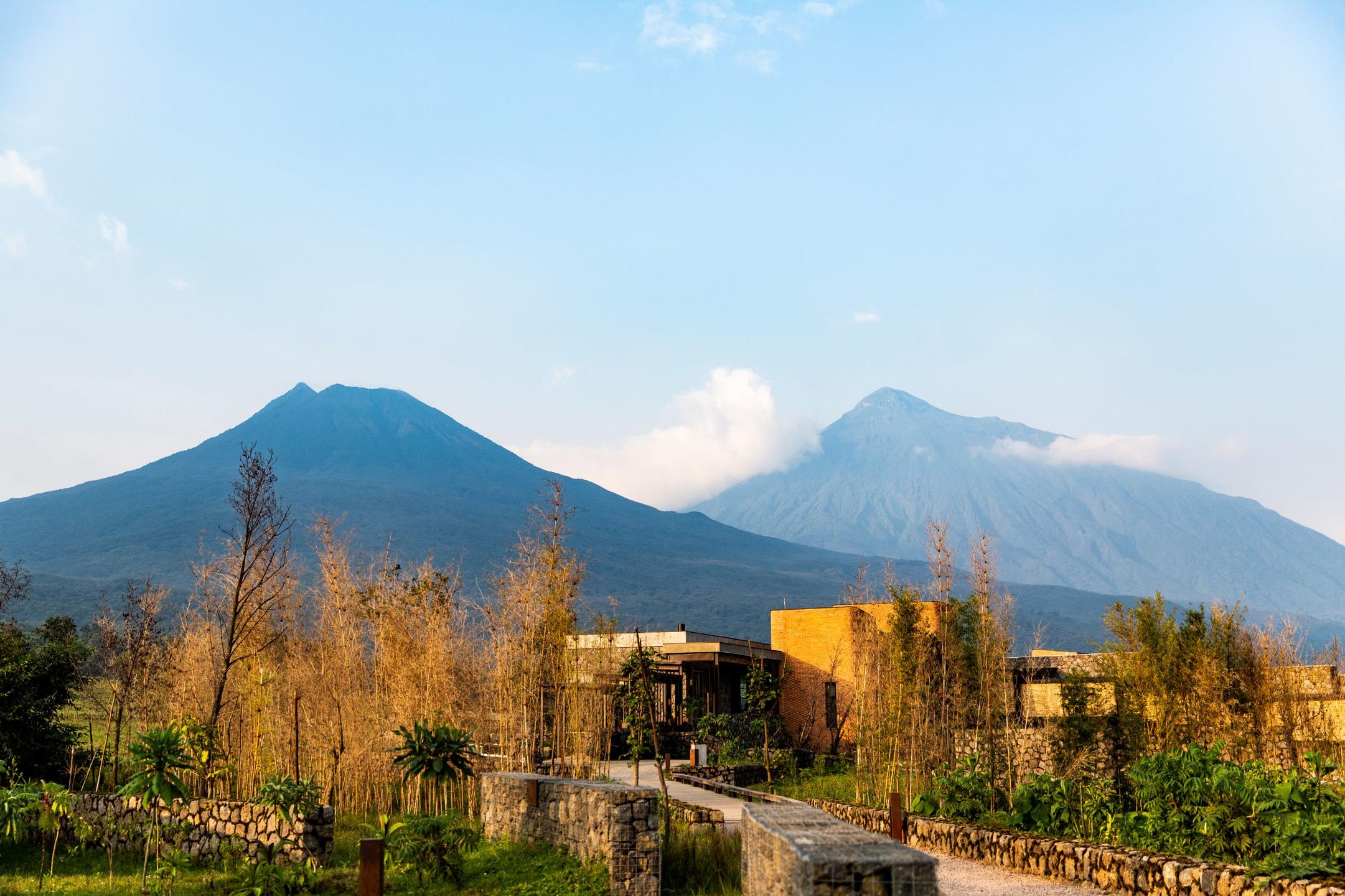 Luxury lodge exterior in Rwanda's volcanic landscape